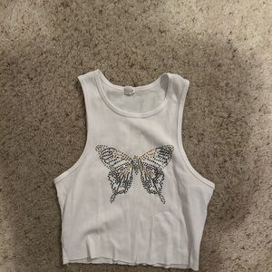 White, muscle top with a gem butterfly from garage store. Only worn once